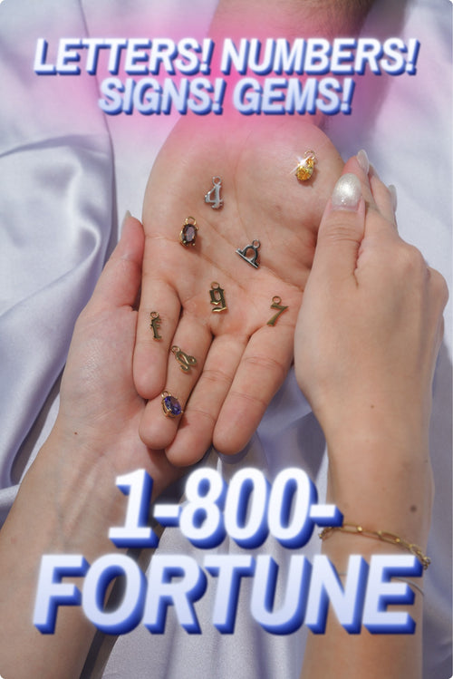 in the wild — 1-800-FORTUNE charms in hand, gold, silver